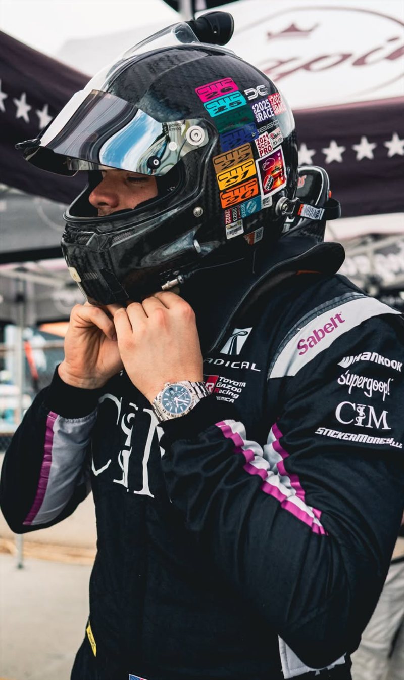 Nick Pearson fastening his helmet